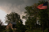 Storm over the barn and house.